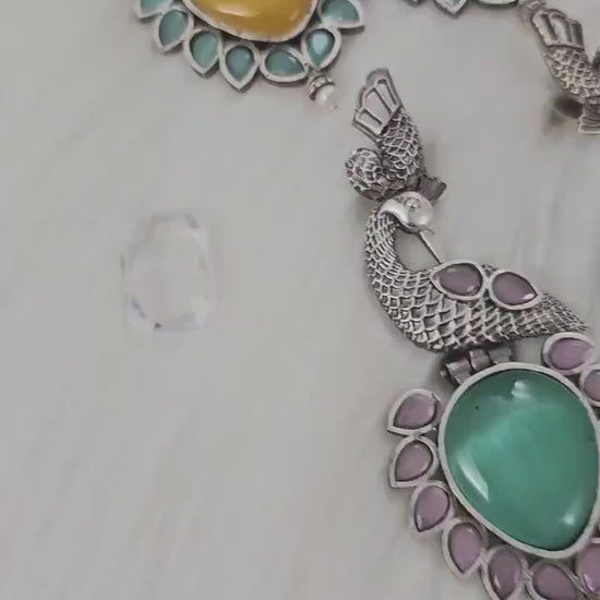 Dazzling Long earrings in unique pattern. Silver Replica with Monalisa Stones.